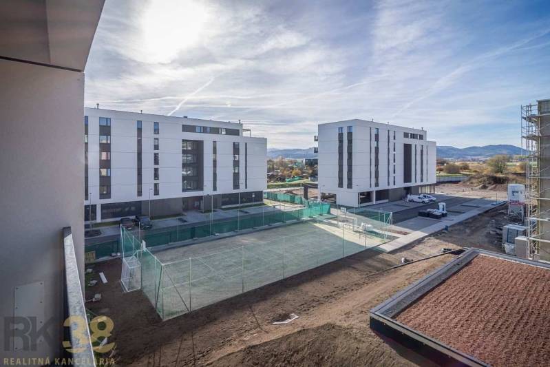 New apartment buildings in Poprad with a playground nearby. View of the mountain panorama.