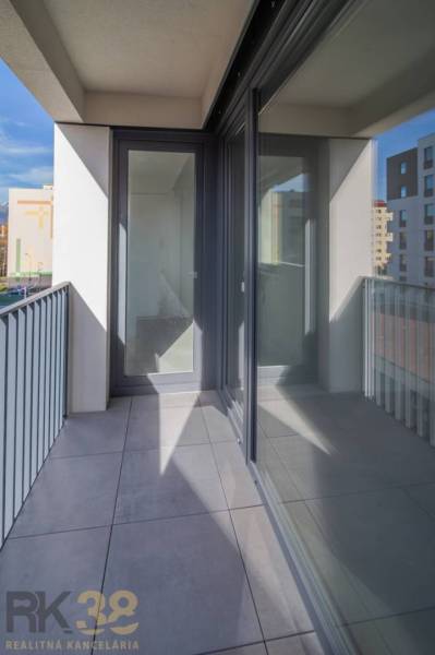 Balcony with large glass doors in a 2-room apartment, view of Poprad.