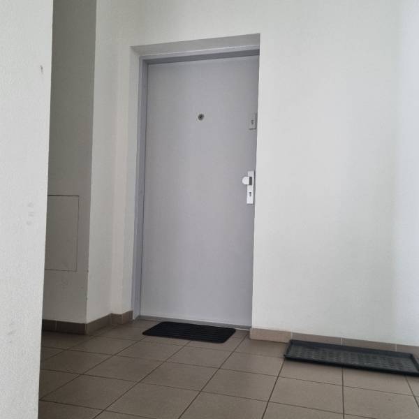 Anodized doors and tiles in a studio apartment.