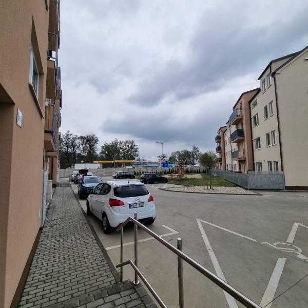 Parking lot near apartment buildings on Pezinská Street in Malacky.
