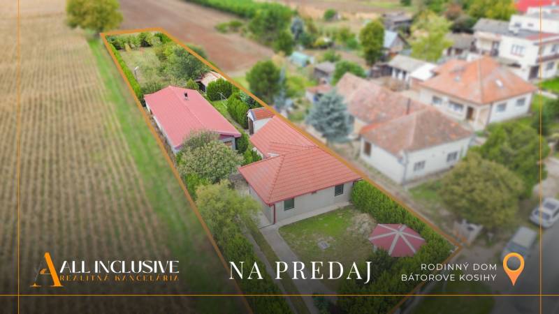 A family house in Bátorove Kosihy with a large garden surrounded by greenery.