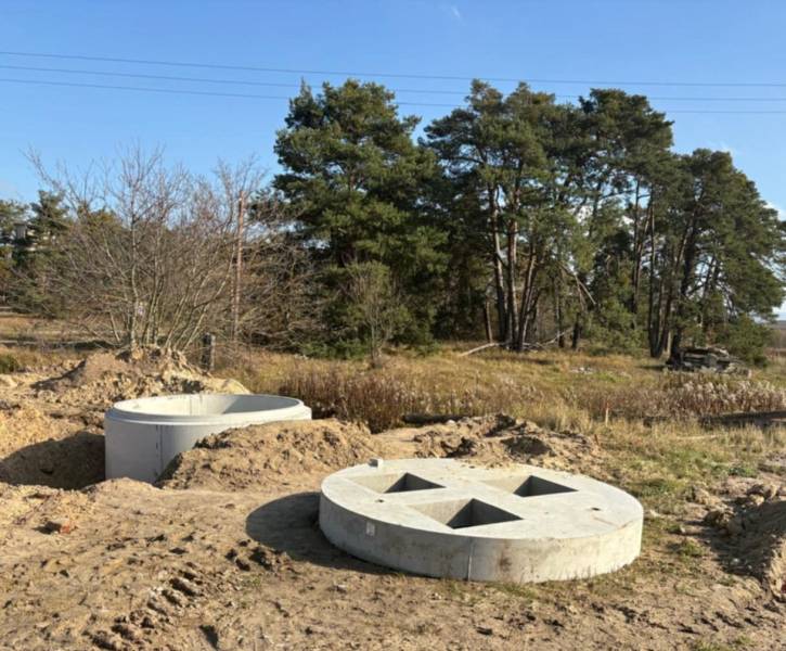 Concrete structures for living, Studienka, Pod Borovicou, surrounded by vegetation and trees.