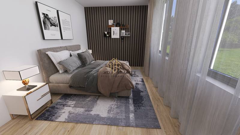 Bedroom in a family house with decorative paneling, a bed, and a floor with a wooden decor.