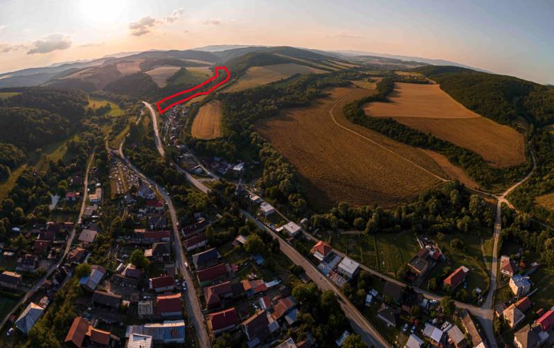Aerial view of agricultural and forest lands around Rokycany at sunset.