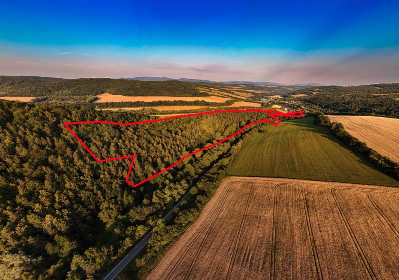 Agricultural and forest land near Rokycany, forest and fields with a red outline.