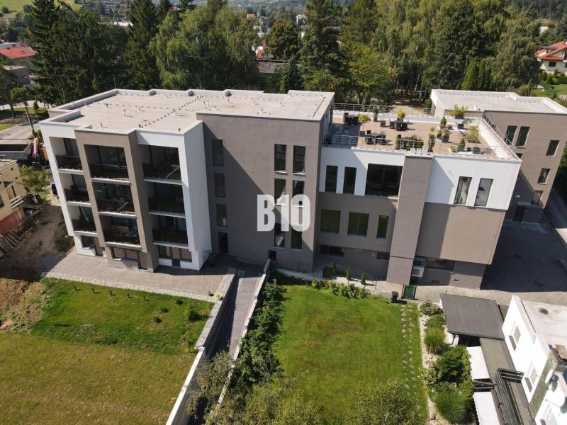 Apartment complex on M. R. Štefánik Street in Rajecké Teplice surrounded by greenery.