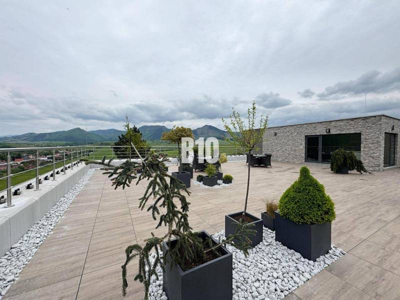 A spacious terrace with a view of the hills in Rajecké Teplice on M. R. Štefánika Street.