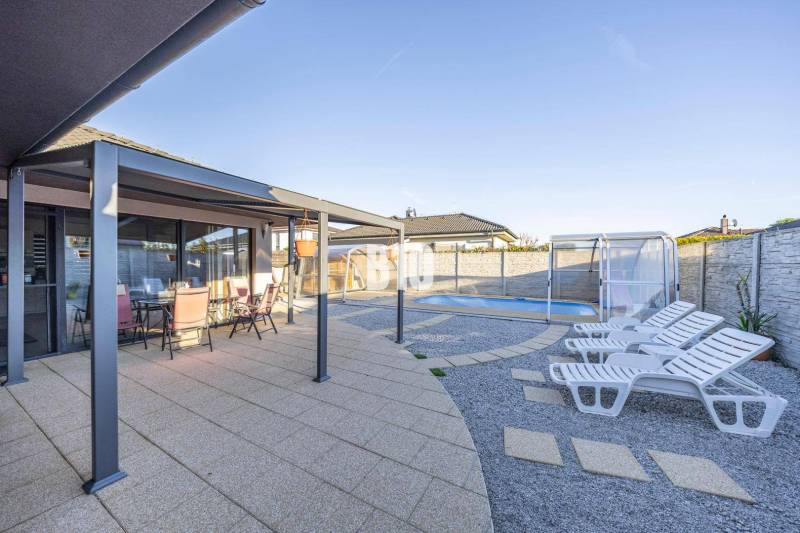 A family house in Most pri Bratislave with a terrace, gazebo, and swimming pool.