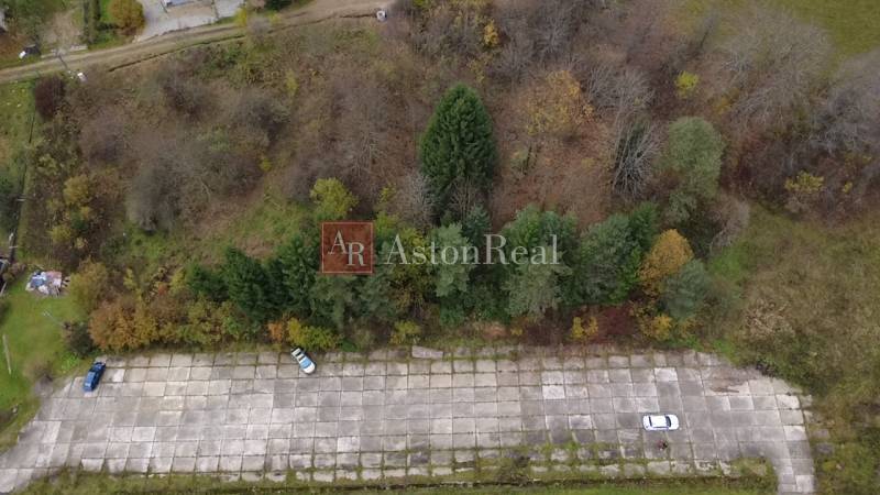 Aerial view of a paved area surrounded by greenery in the recreational grounds Čertov, Lazy pod Makytou.