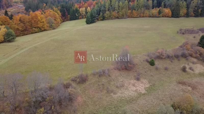 Autumn scenery of recreational grounds in Lazy pod Makytou, Čertov, with colorful trees on the horizon.