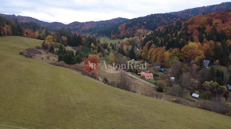 A landscape with an autumn forest and houses on recreational plots in Čertov, Lazy pod Makytou.