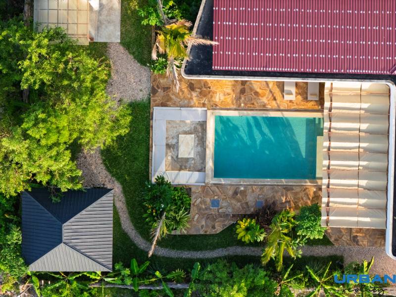 Aerial view of house construction with a swimming pool in the suburb of Paje, Unguja South Region.
