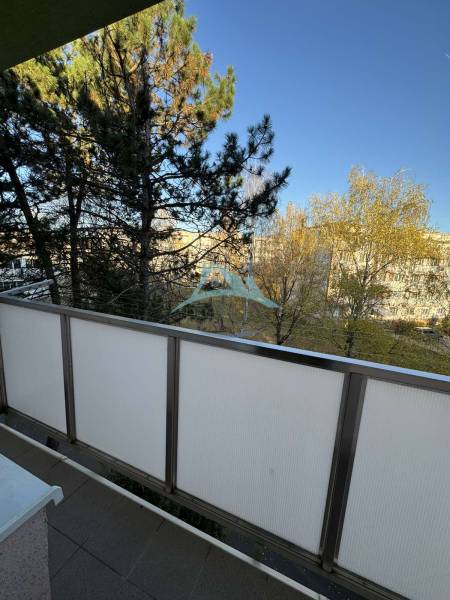 A balcony with a view of trees at a 3-room apartment on Vajanského Street in Šahy.