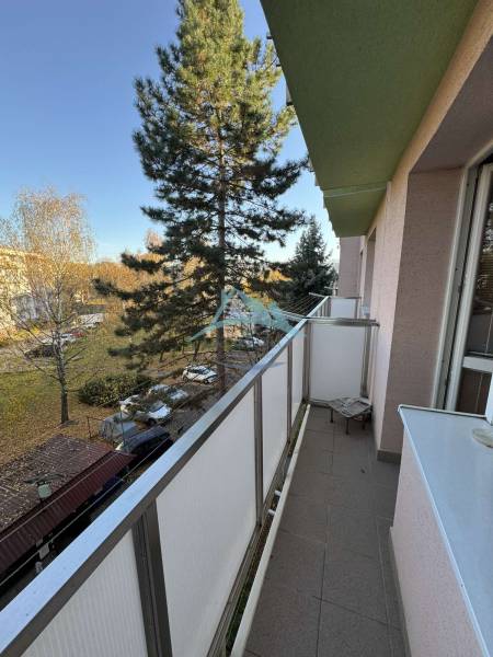 Balcony of a 3-room apartment on Vajanského Street in Šahy with a view of greenery.