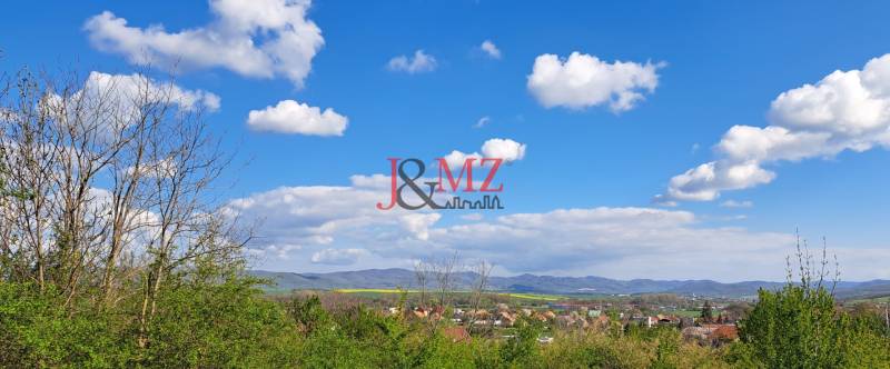 Landscape with a view of Land - housing in Dolné Žemberovce, Žemberovce, with a blue sky.