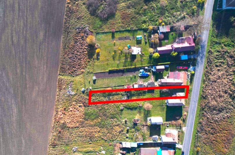 A residential plot in Radnovce surrounded by nature, close to the road.