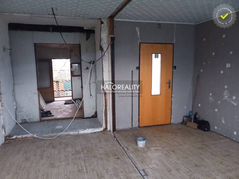 A room with a wooden decor floor and unfinished walls at Recreational Grounds.