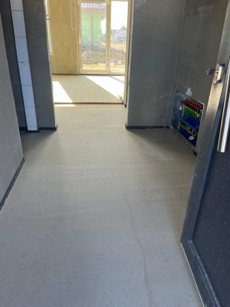 A hallway in a family house with underfloor heating, overlooking Vyšná Šebastová Street.