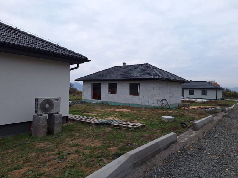 A family house in Vyšná Šebastová, Prešov, under construction, with dark roof tiles.