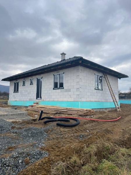 A family house under construction on Vyšná Šebastová street, with construction materials and an unfinished garden.