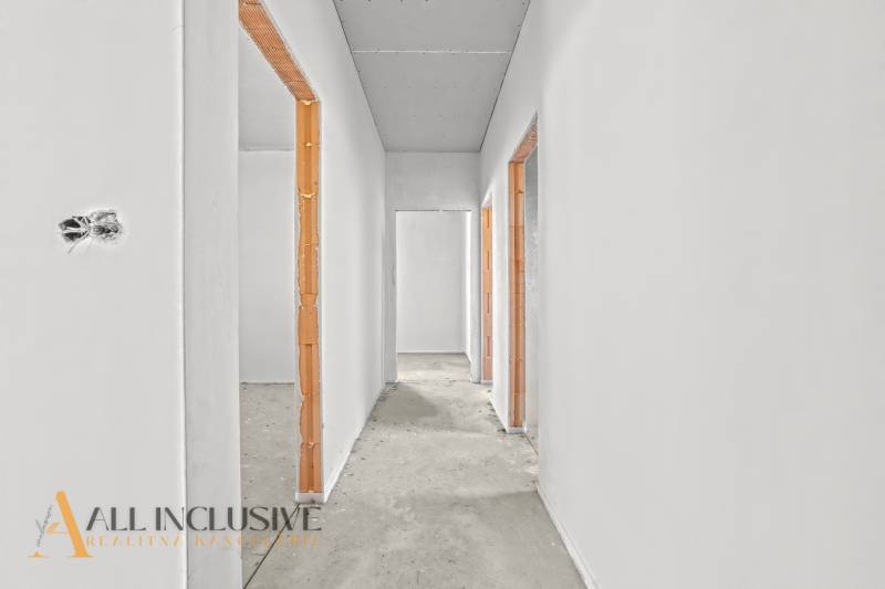 Unplastered hallway in a family house with surfaces ready for finishing.
