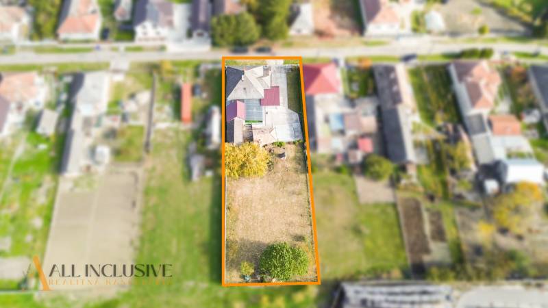 An aerial view of a plot with a family house in Veľké Kosihy, surrounded by neighboring houses.