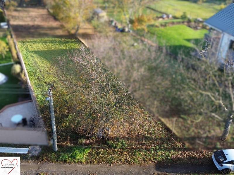 A residential plot in Dolná Krupá on M.H. Chvoteková surrounded by greenery and trees.