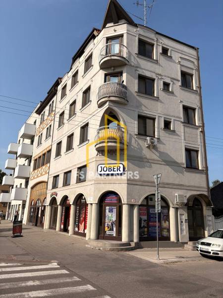 A building with commercial spaces on Petőfi Street in Komárno with interesting balconies.