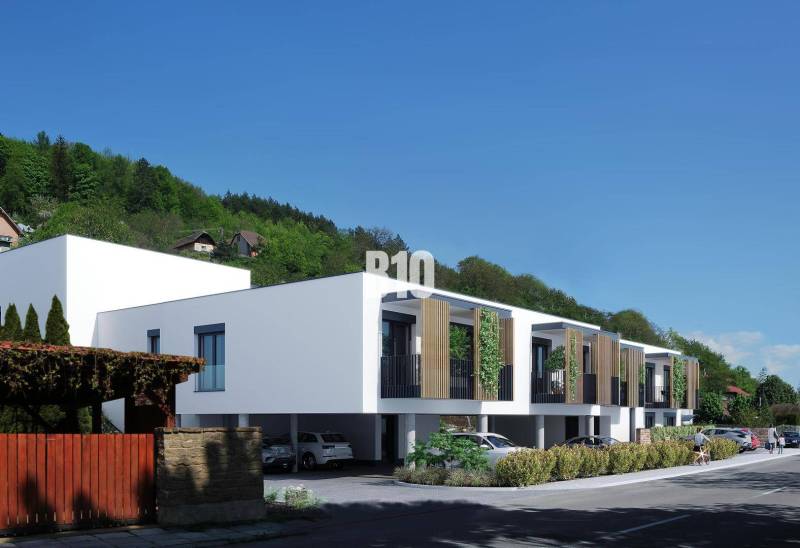 Low modern buildings with wooden elements on Dolná Street in Žilina.