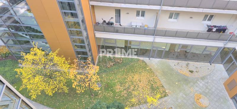 The courtyard of the residential complex on Bezručova in Bratislava - Old Town with a balcony and greenery.