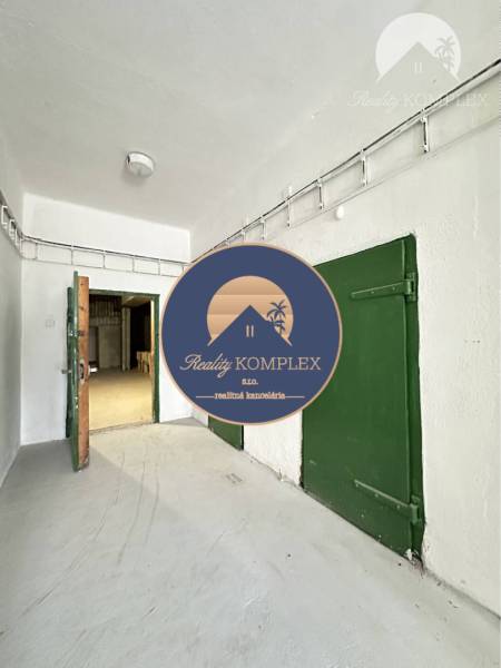 Commercial premises with white walls and green doors, entrance door.