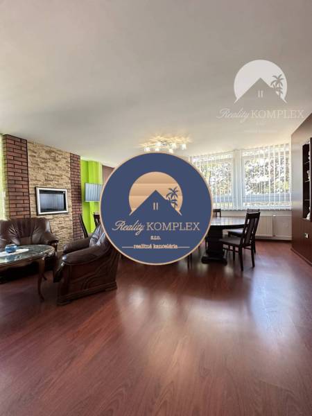 Offices with wood-patterned flooring, leather chairs, and large windows.
