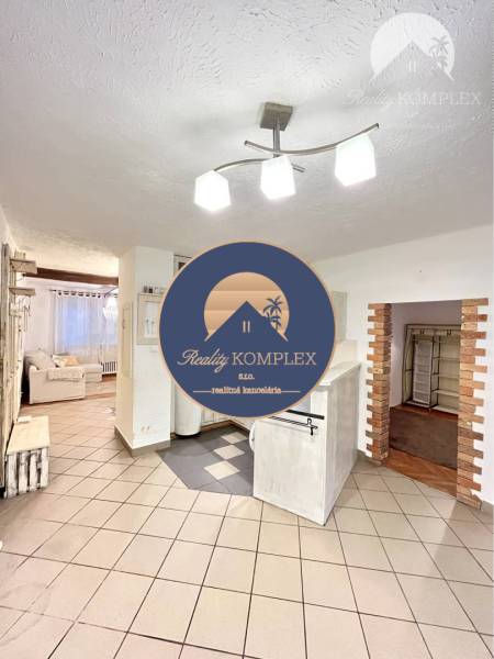 Open space of a 3-room apartment with tiles and a bright interior.