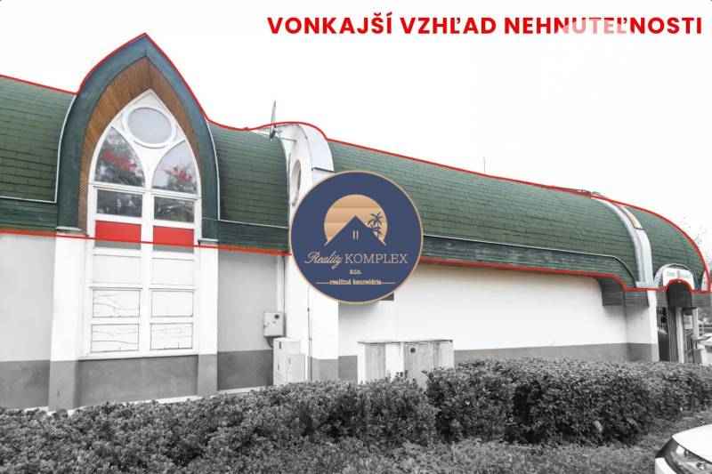 Commercial premises in Komárno with a green roof and large windows in a stylized exterior.