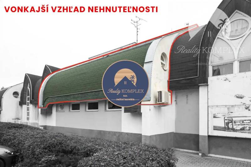 Exterior of commercial premises in Komárno with a curved roof and air conditioning.