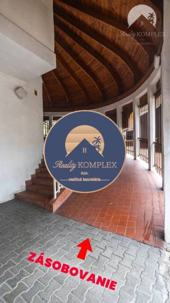 A corridor with stairs and ceramic flooring in commercial premises in Komárno.
