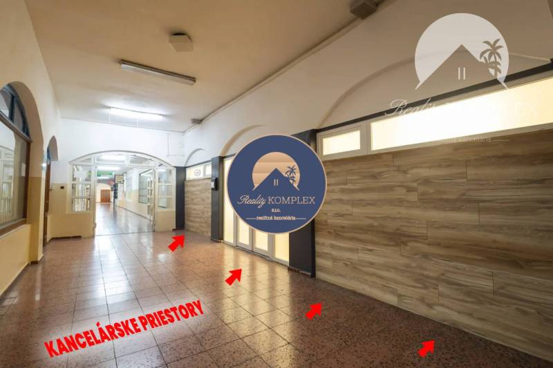 Interior of commercial spaces with a stone floor and a wall with wooden decor.