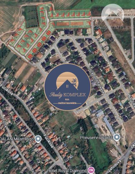 Aerial view of residential land in the town of Veľký Meder with development.