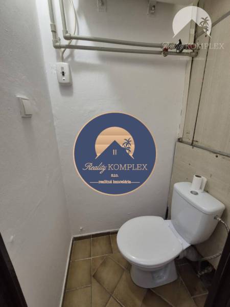 Bathroom with tiles in a studio apartment.