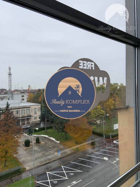 View from commercial premises on Milan Rastislav Štefánik Square in Komárno, autumn trees.