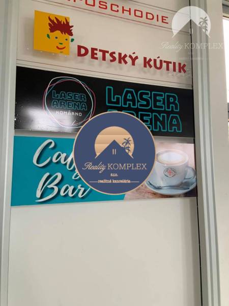 Children's Corner and Laser Arena in commercial premises. Advertising board of the café and bar.