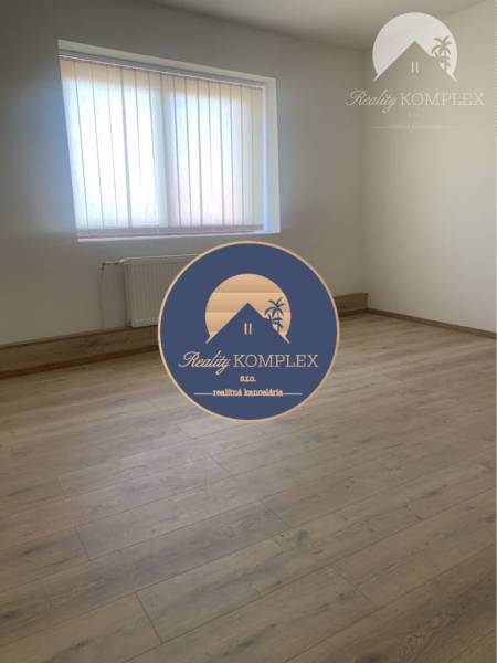 A room with walls, a window, and a wooden decor floor in warehouses and halls.