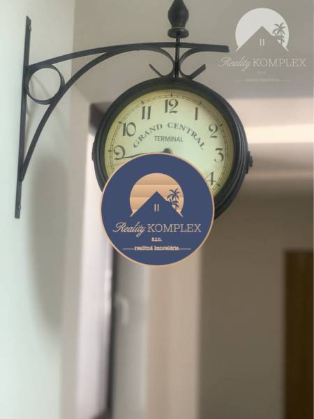 Wall clock with the inscription 