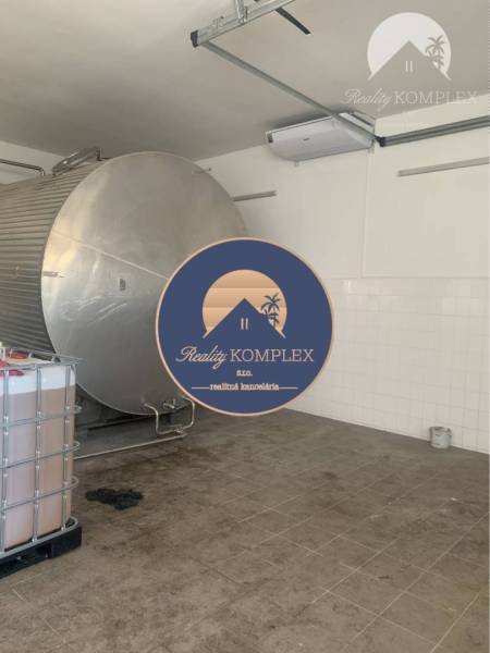 Interior of warehouses and halls with a stainless steel tank and wall cladding.