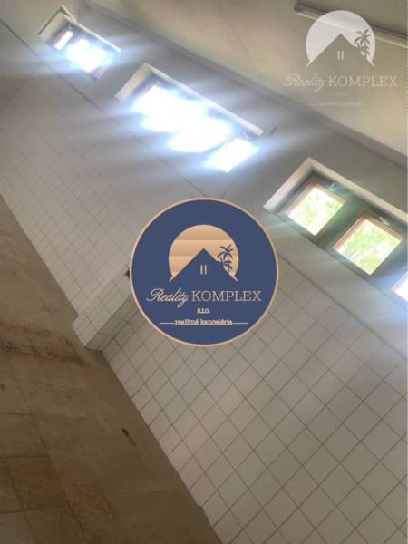 Interior of a warehouse with a tiled wall and windows, Warehouses and halls.