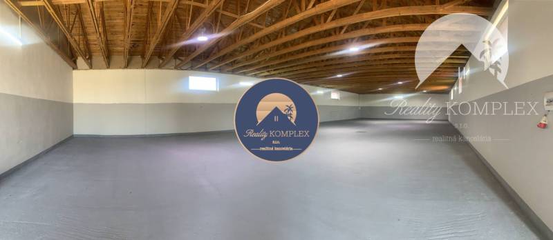 Interior in warehouses and halls with light walls and wooden ceiling.