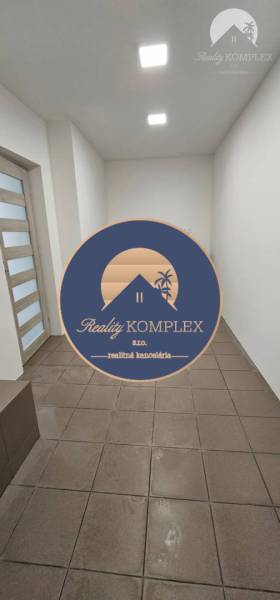 Commercial premises with tiles, simple walls, and glass doors.