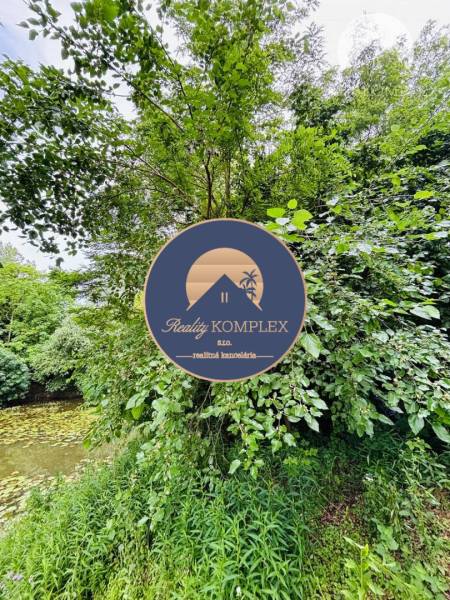 Greenery and river suitable for plots - housing in Dedina Mládeže.