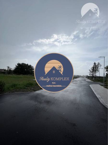 Asphalt road between residential plots on Bučuháza Street in Šamorín.