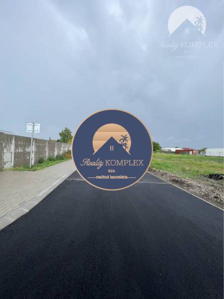 New asphalt road on Bučuháza Street in Šamorín, Residential plots, next to the sidewalk.